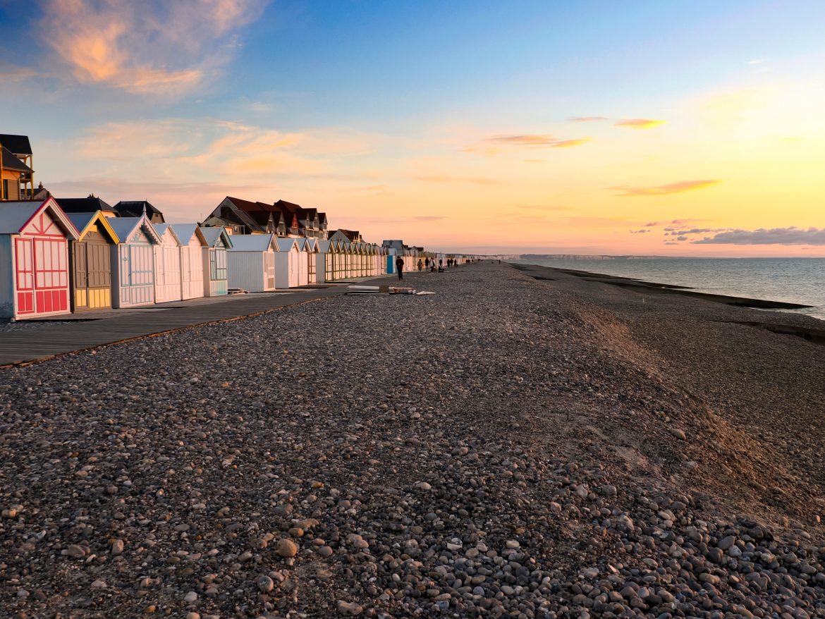 Sunset on the sea with gulls at Cayeux sur Mer, a resort town in